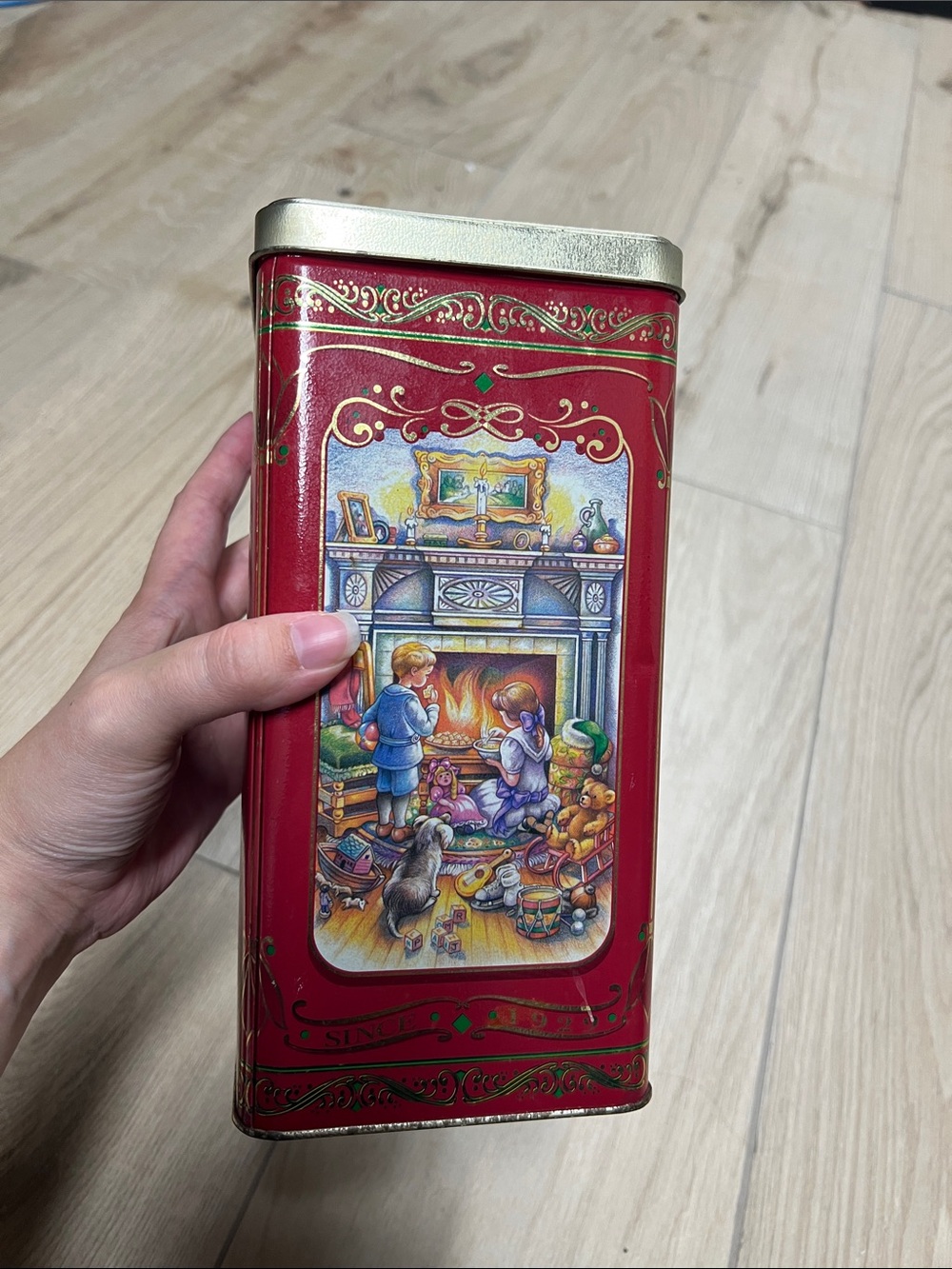 Vintage Holiday Decorative Red Tin Canister with Festive Fireplace Illustration